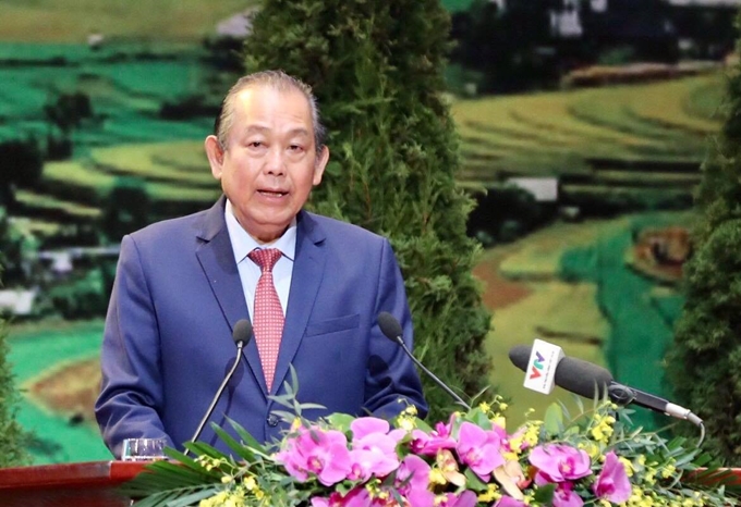 Truong Hoa Binh, membre du Bureau politique du Parti, vice-Premier ministre permanent, également chef du comité directeur du Congrès, s'exprime à l'ouverture du Congrès. Photo: CPV