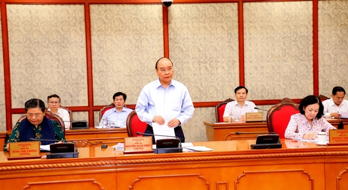 Lors de la séance de travail entre des membres du Politburo et les représentants de l'organisations du Parti pour la province de Nghe An. Photo: CPV