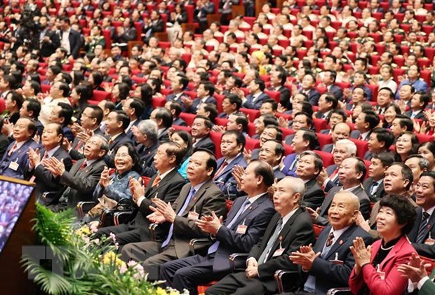 Des délégués participent à la cérémonie d’ouverture du 13e Congrès national du Parti. Photo: VNA