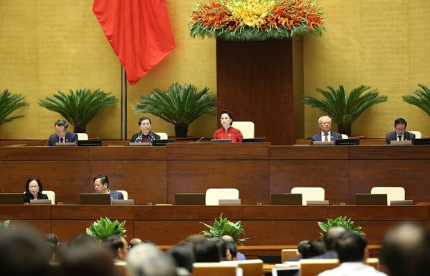 Les députés de l'Assemblée nationale discutent du projet de rapport de travail pendant la 14e législature de l’Assemblée nationale. Photo: VNA